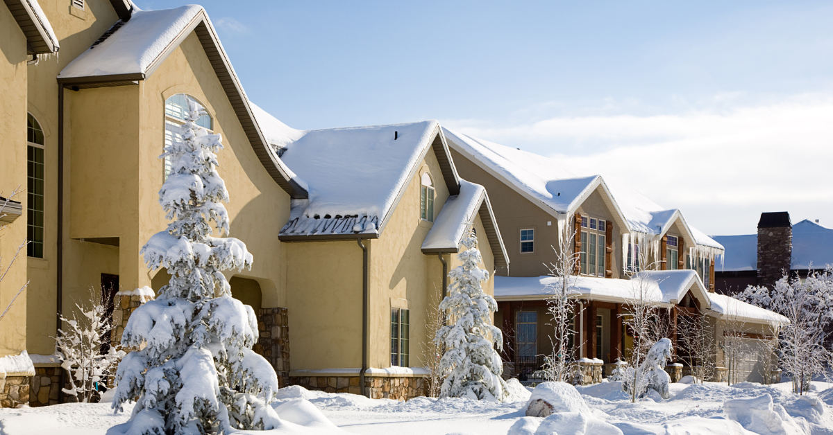 Snow-covered stucco homes