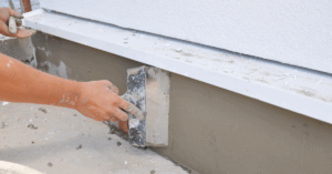 Stucco contractor applying stucco