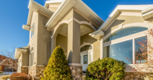 large residential home with a stucco exterior